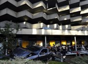 24 Year Old Man Launches Mustang GT Off of a Parking Garage!